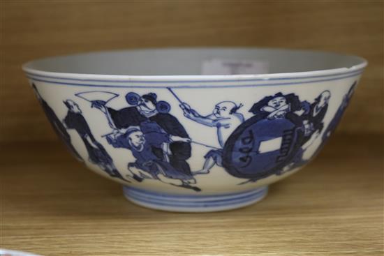 A Chinese blue and white bowl, and three assorted saucers, bowl diameter 20cm